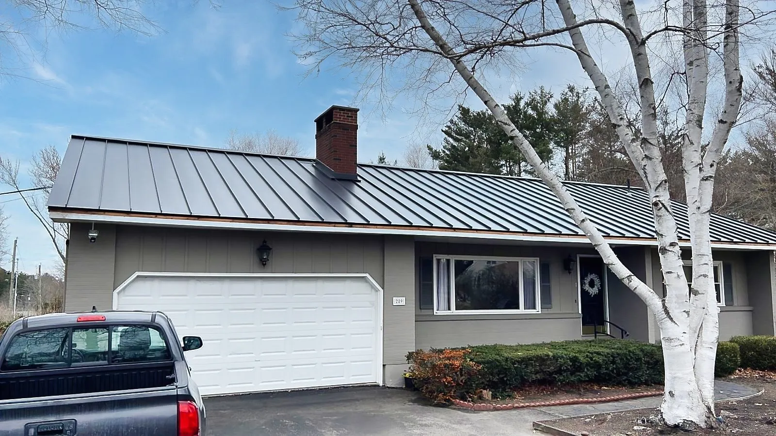 Homeowner project: standing seam metal roof over a ranch home and garage