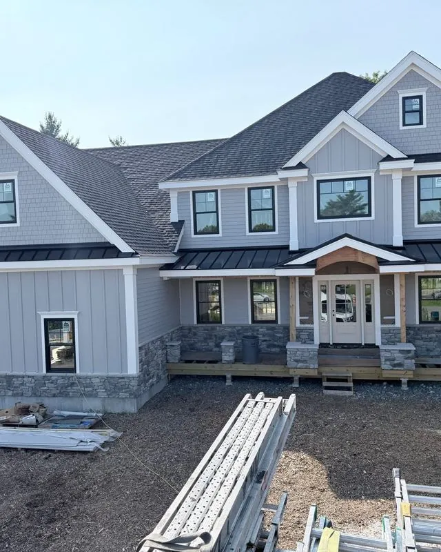 Two-story home with a standing seam porch roof