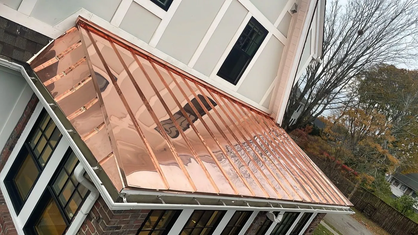 Copper standing seam roof over a bay window