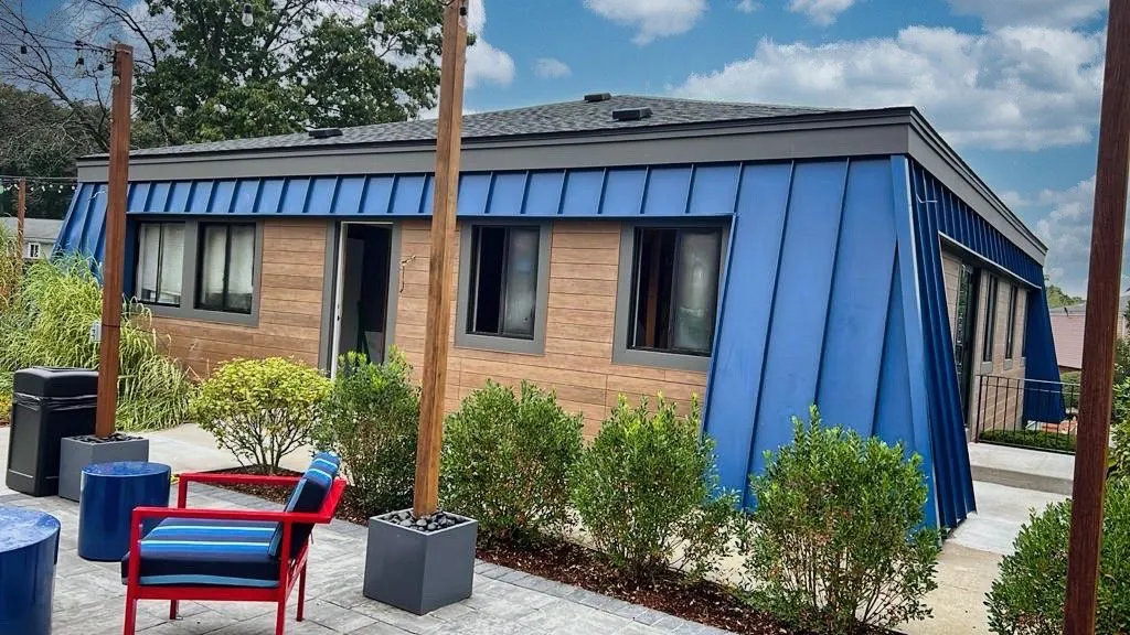 Blue standing seam with board-and-batten siding