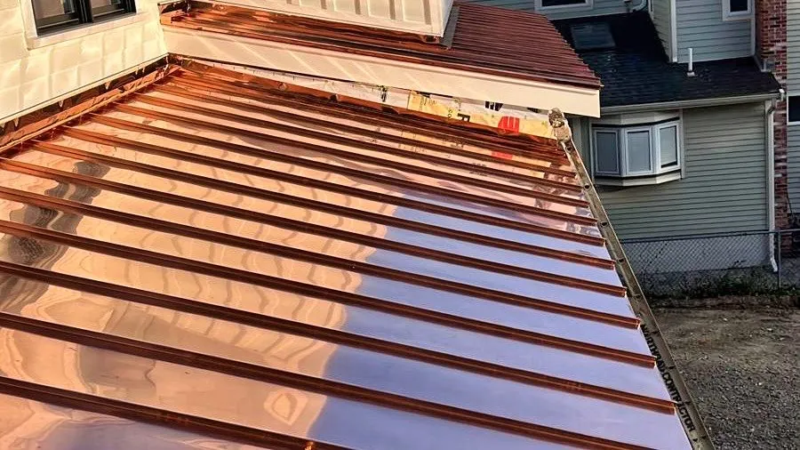 Low-slope copper roof along the house