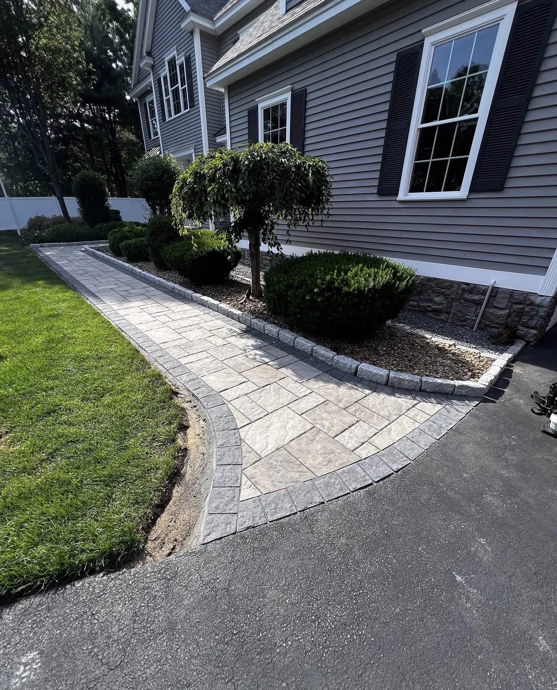 Curved walkway from the driveway