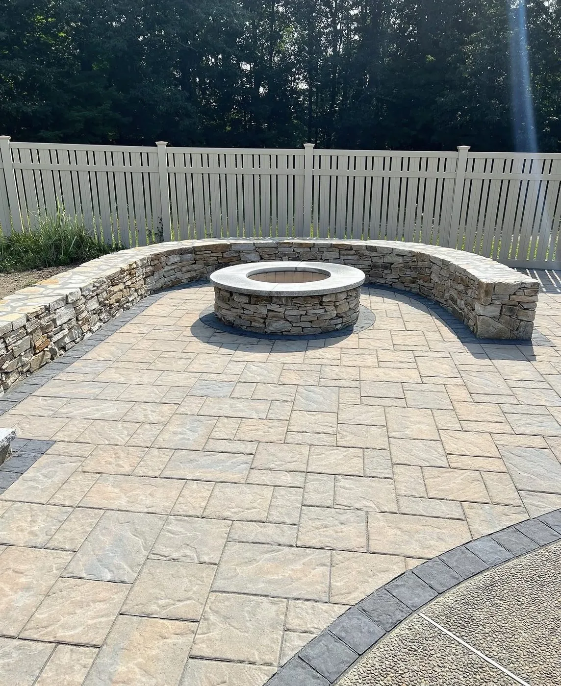 Patio with stone seat wall and fire pit