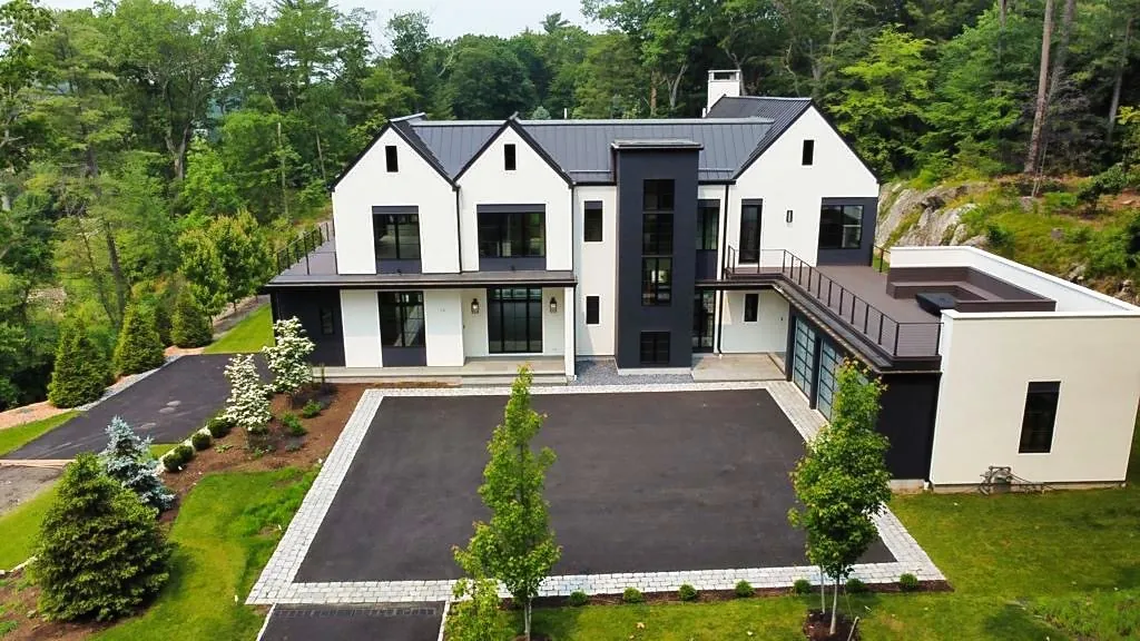 Modern farmhouse with a standing seam roof, seen from above